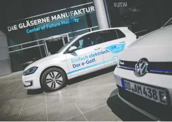  ?? JENS SCHLUETER/ GETTY IMAGES FILES ?? A big test for wannabe Teslas will come when they've burned though their cash and need to ask investors for more, says Chris Bryant. Above, Volkswagen's e-golf electric cars.