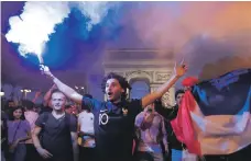  ?? Reuters ?? France fans celebrate on the Champs-Elysees after defeating Belgium in their World Cup semi-final match on Tuesday