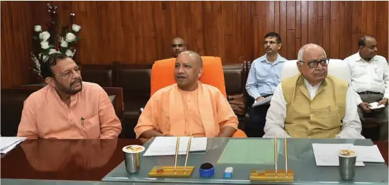  ??  ?? Uttar Pradesh chief minister Yogi Adityanath is playing a wait- and- watch game over the thorny issue of allowing reservatio­n in promotions of government employees.