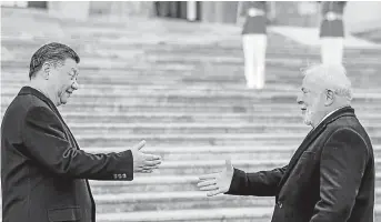  ?? ?? El presidente chino Xi Jinping (izq.) y Luiz Inácio Lula da Silva.