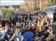 ?? ASSOCIATED PRESS ?? In a photo obtained by The Associated Press, university students attend a protest Saturday inside Tehran University as anti-riot Iranian police prevent them from joining other protesters.