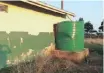  ??  ?? AN empty Jojo tank at one of the schools signalling the shortage of water.