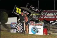  ?? RICK KEPNER - FOR DIGITAL FIRST MEDIA ?? Scott Lutz celebrates in victory lane after his win at Grandview Speedway on June 24.