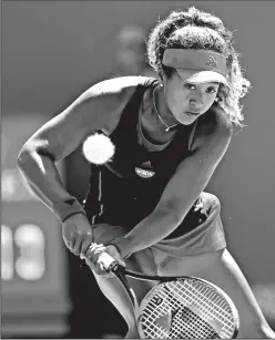  ?? CHARLES TRAINOR JR./TRIBUNE NEWS SERVICE ?? Naomi Osaka returns a shot against Elina Svitolina in the second round at the Miami Open on Key Biscayne, Fla., on Friday. Svitolina advanced, 6-4, 6-2.