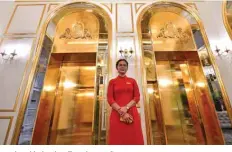  ??  ?? A staff member stands near the lifts in the lobby of the newly-inaugurate­d Dolce Hanoi Golden Lake hotel.