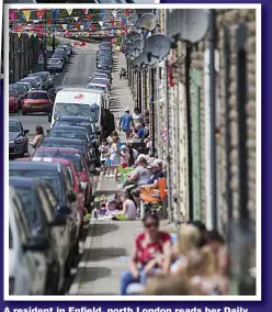  ??  ?? A resident in Enfield, north London reads her Daily Express and enjoys the atmosphere left, and, above, a street in Gelli, South Wales, is ablaze with bunting