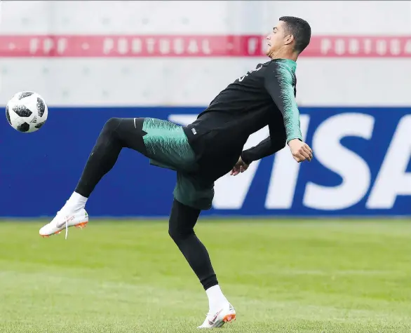  ?? FRANCISCO LEONG/AFP/GETTY IMAGES ?? Portugal superstar Cristiano Ronaldo will need to come through Friday if his national team has any hope of beating Spain in their World Cup opener.