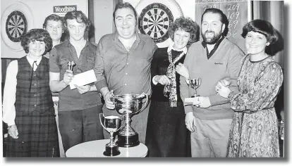  ?? ?? It was a family affair. Mary Taylor, far left, Christine Beasley and Margaret James on the right; the wives of Harry, Derek and David, at a Bugle darts presentati­on