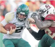  ?? [PHOTO BY BRYAN TERRY, THE OKLAHOMAN] ?? Oklahoma’s Mark Jackson Jr., right, sacks Baylor quarterbac­k Charlie Brewer during Saturday’s game at Gaylord Family-Oklahoma Memorial Stadium in Norman. Oklahoma won, 66-33.