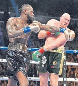  ??  ?? Deontay Wilder and Tyson Fury during the WBC Heavyweigh­t Championsh­ip bout at the Staples Center in Los Angeles.