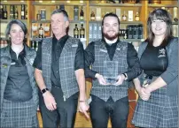  ??  ?? Oban Distillery staff members, Piedad Carrion, Stuart Calder, Kyle Forsyth and Shona MacVicar show off the award.