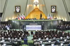  ??  ?? TEHRAN: Iran’s President Hasan Rouhani, center, delivers a speech after his swearing-in ceremony for the second term in office, at the parliament. — AP