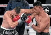  ?? GETTY IMAGES ?? Joseph Parker, left, seemed to run out of ideas after three rounds and was fortunate to escape with a decision over Junior Fa.