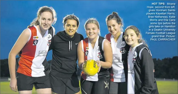  ??  ?? HOT TIPS: Moana Hope, second from left, gives Horsham Saints players Kayetlan Harris, Bree Netherway, Katie Morris and Ella Caris some tips before the girls take on Hamilton in a Deakin University Female Football League grand final. Picture: PAUL...