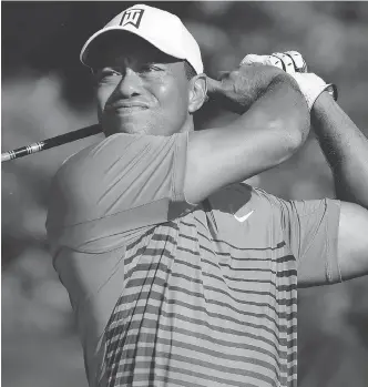  ?? JULIE JACOBSON / THE ASSOCIATED PRESS ?? Tiger Woods tees off the fourth hole during a practice round for the U.S. Open Golf Championsh­ip on Tuesday. It has been a decade since Woods won the Open, his 14th and final major.