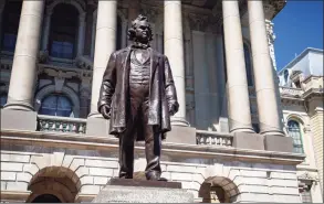  ?? Justin L. Fowler / Associated Press ?? In this Aug. 19 file photo, a statue of Stephen Douglas stands in front of the east entrance to the Illinois State Capitol, in Springfiel­d, Ill. Crews on Saturday used equipment to remove the statue.