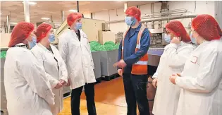  ?? ?? Sweet success The MSP touring the Lees of Scotland factory with SVQ candidates