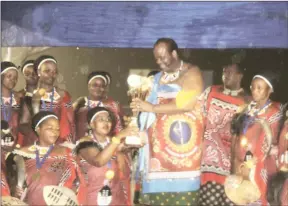  ?? ?? Nkwene Lutsango all smiles as they receive their trophy from the King.