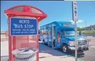  ??  ?? BELOW: One of the North Central Regional Transit District’s blue buses makes a stop at the South Capitol Rail Runner station earlier this week.