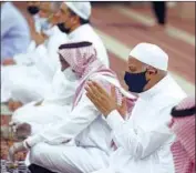  ?? Amr Nabil Associated Press ?? IN JIDDA, Saudi Arabia, worshipers at Al Mirabi Mosque wear masks during prayers Sunday. Mosques in the kingdom closed for more than two months.