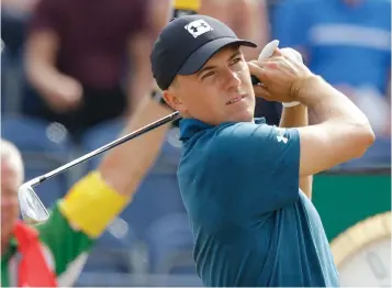  ?? Associated Press ?? ■ Jordan Spieth plays a shot off the third tee during the third round of the British Open Golf Championsh­ip on Saturday in Carnoustie, Scotland.