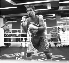  ??  ?? File photo of Manny Pacquiao training at a gym in Manila. — AFP photo
