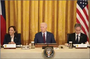  ?? (AP/Mark Schiefelbe­in) ?? President Joe Biden (center) speaks as Vice President Kamala Harris (left) and Secretary of State Antony Blinken, listen during a trilateral meeting with Philippine President Ferdinand Marcos Jr. and Japanese Prime Minister Fumio Kishida in the East Room of the White House in Washington on Thursday. Video at arkansason­line.com/412japanph­ilippines/.