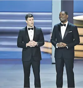  ?? Live ?? MASTERS OF CEREMONY. The Emmys were hosted by Saturday Night regulars Colin Jost and Michael Che.