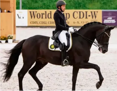  ??  ?? Good outing: National equestrian rider Qabil Ambak finished second in the CDIW World Cup in Belarus recently.