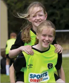  ??  ?? Maeve Bookle and Abbey O’Sullivan from Tullogher having fun at the soccer summer camp at Ross Celtic FC.