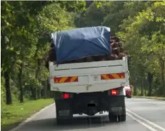  ??  ?? An overloaded lorry cruising along Jalan Trusan.