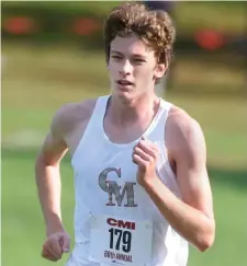  ?? JiM MiCHAuD / boston HerAlD ?? IN FRONT: Catholic Memorial’s Chris Sullivan won the 5K race at the CM Invitation­al on Saturday.