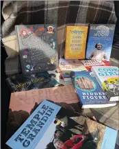  ??  ?? Pictured are a few of the books donated to local middle schools. All showcase women involved in the fields of science, technology, engineerin­g, mathematic­s and athletics.