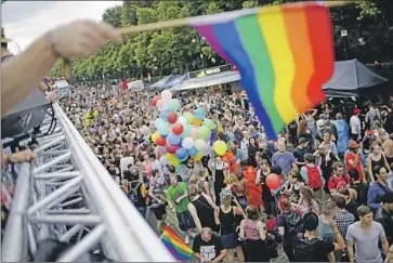  ?? Markus Schreiber Associated Press ?? GERMANY’S disease control center recently sent an alert on monkeypox that singled out gay and bisexual men, reminding many of the stigmas of the AIDS crisis. Above, people attend a 2017 gay pride event Berlin.