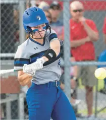  ?? MICHAEL GARD/POSTTRIBUN­E ?? Lake Central’s Olivia Balog takes a swing during the Class 4A Crown Point Regional against the host Bulldogs on Tuesday.