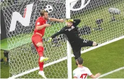  ?? GETTY IMAGES ?? England’s Harry Kane ( left) vies for the ball with Tunisia goalie Moez Hassen during a Group G game at theWorld Cup in Volgograd, Russia.