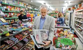  ??  ?? Jeremy Corbyn, leader of Britain’s opposition Labour Party, looks at newspapers in Islington, London, on Saturday. REUTERS