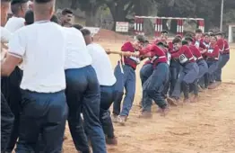  ?? AIJAZ RAHI/AP ?? Female Indian army recruits compete in a tug-of-war with male recruits. A court ruling now lets women apply for top careers in the South Asian country’s military.