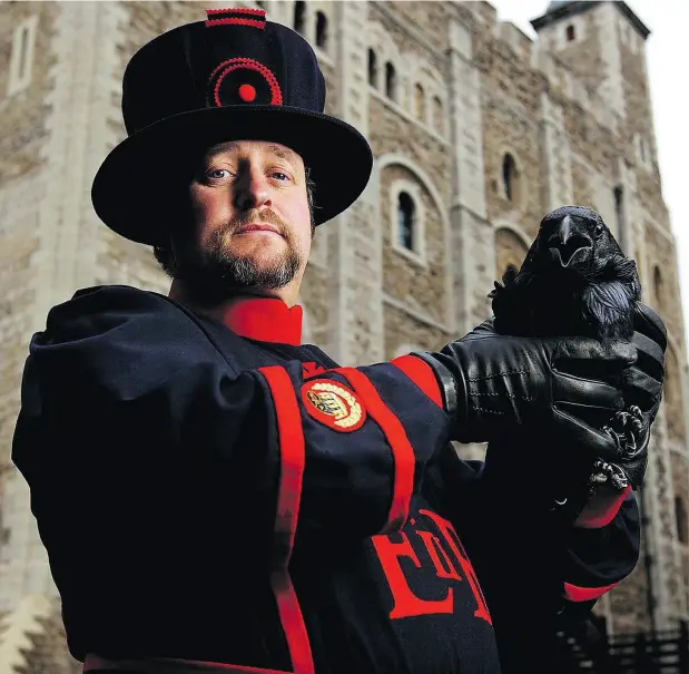  ?? HARPER COLLINS ?? Christophe­r Skaife, the Ravenmaste­r at the Tower of London, is shown with one of his charges. Skaife has written a memoir about his experience.