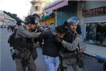  ?? AFP ?? Israeli security forces detain a Palestinia­n protester in East Jerusalem yesterday