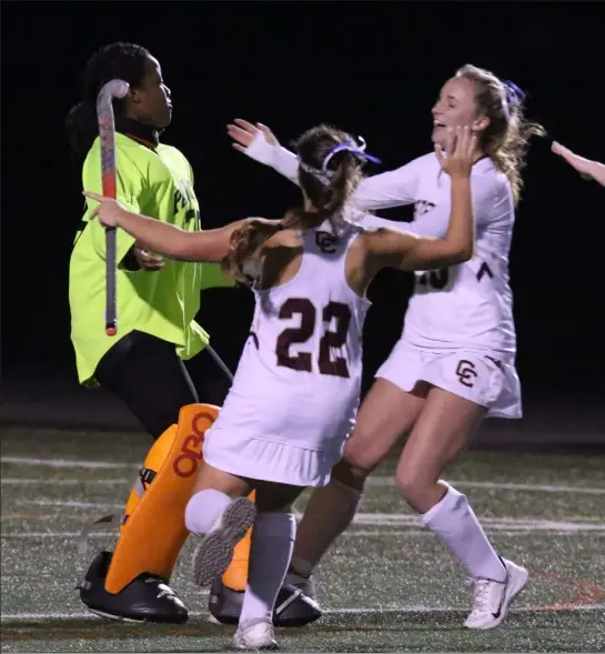  ?? Julia malakie / LOWELL sun ?? Concord-carlisle goalie Lorena neptune (35), emma Gebhart (22) and megan fairbank (15) celebrate the team’s 3-0 win over Chelmsford.