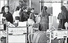  ??  ?? Migrant workers at the airport