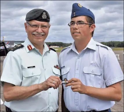  ?? CODY MCEACHERN/TRURO DAILY NEWS ?? Cadet Dawson Fraser, of Trenton, graduated from the cadet glider pilot course in Debert last Friday, receiving his wings and pilot licence from Brigadier General Kelly Woiden. He hopes to continue his flying career by getting accepted for the cadets...