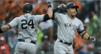  ?? GAIL BURTON — THE ASSOCIATED PRESS ?? The Yankees’ Giancarlo Stanton, right, celebrates his home run with Gary Sanchez in the third inning against the Orioles on Saturday in Baltimore.