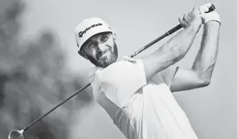  ?? Nathan Denette/The Canadian Press via AP ?? LEADER. Dustin Johnson of the United States hits his tee shot on the 17th hole during round three of the Canadian Open at the Glen Abbey Golf Club in Oakville, Ontario Saturday, July 28, 2018.