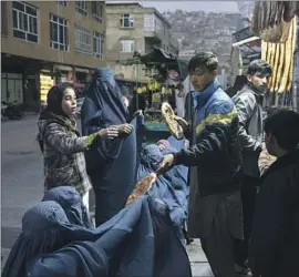  ?? Petros Giannakour­is Associated Press ?? THE TALIBAN government will not have access to the humanitari­an fund, which will be held in Switzerlan­d. Above, bread is distribute­d in Kabul last year.