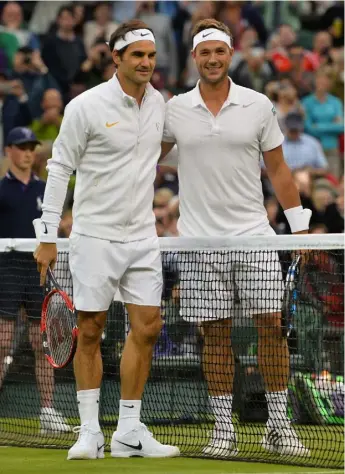  ??  ?? Esquire Alongside Roger Federer on Centre Court ahead of their second round tie at Wimbledon 2016. Despite losing in straight sets, Willis took seven games off the Swiss, serving up nine aces and smashing 24 winners