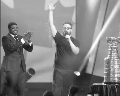  ?? CANADIAN PRESS PHOTO ?? Montreal Canadiens’ P.K. Subban left, looks on as Seth Rogen, performs Hilarity for Charity in Montreal recently. The show will air Sunday on the Comedy Network.