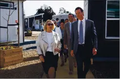  ??  ?? Andrea Urton, CEO of HomeFirst, and Gov. Gavin Newsom tour San Jose’s first Bridge Housing Community for the homeless in February 2020 in San Jose.