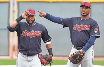  ??  ?? ROSS D. FRANKLIN, AP Edwin Encarnacio­n, right, signed a three-year, $60 million contract to join the Indians.